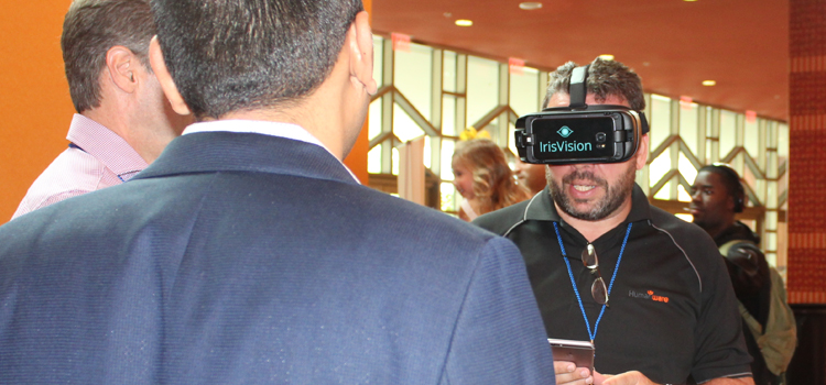 A man demonstrates a head-mounted assistive vision device