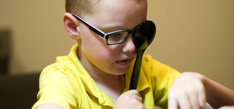 Young child working on puzzle