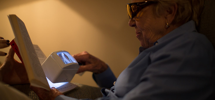 Women using a lighted magnifier