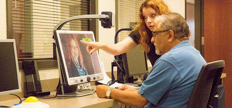 Man being shown picture on monitor