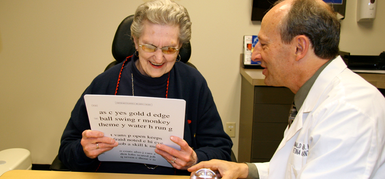 Patient receiving a low vision assessment by a doctor