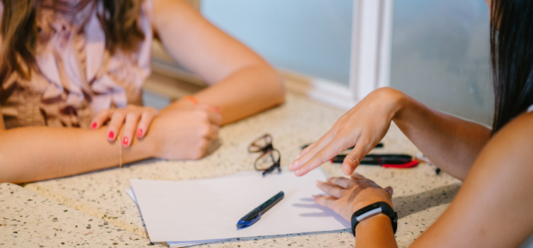 Photo of two women in an interview setting